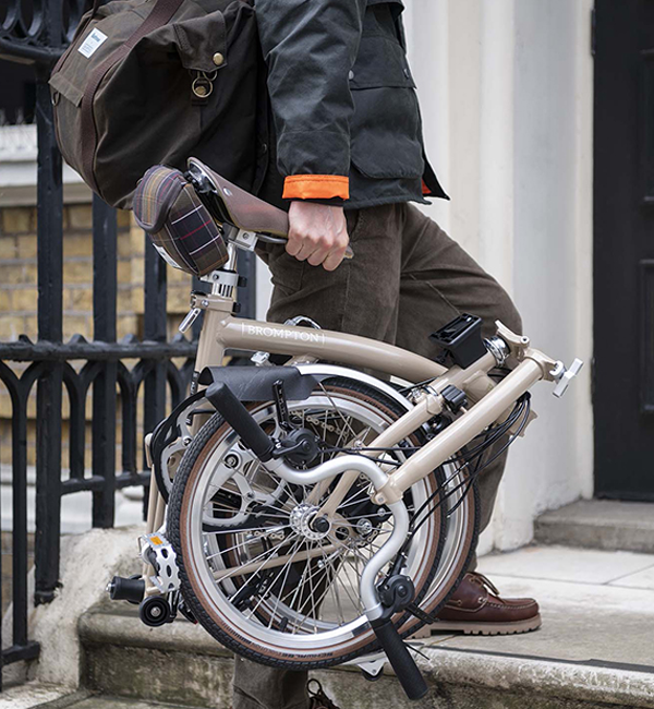 Carrying a Brompton bike wearing a Barbour jacket